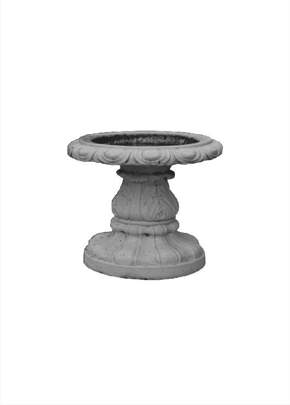 Decorative concrete bird bath with ornate carvings and pedestal base, perfect for garden or outdoor settings